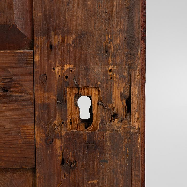 A corner cabinet, 18th Century.