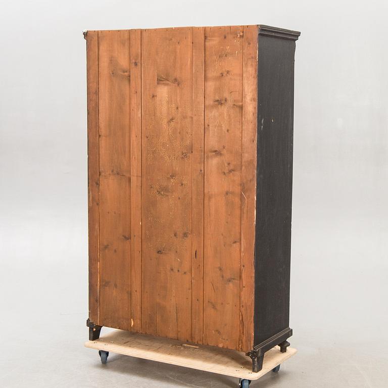 A painted early 1900s display cabinet.