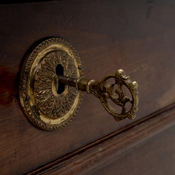 A Franch Directoire mahogany and marble commode, late 18th century.