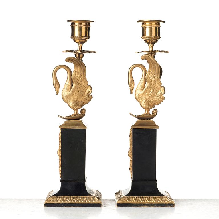 A pair of Empire early 19th century candlesticks.