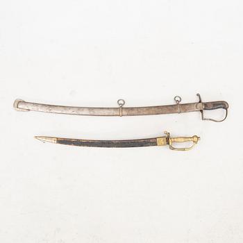 Sabel för manskap inom artilleriet, m/1831 Sverige samt Huggare, Sverige m/1856; förändringsmodell av huggare 1748.