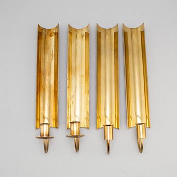 A set of four 'Reflex' brass wall scones by Pierre Forsell, Skultuna.