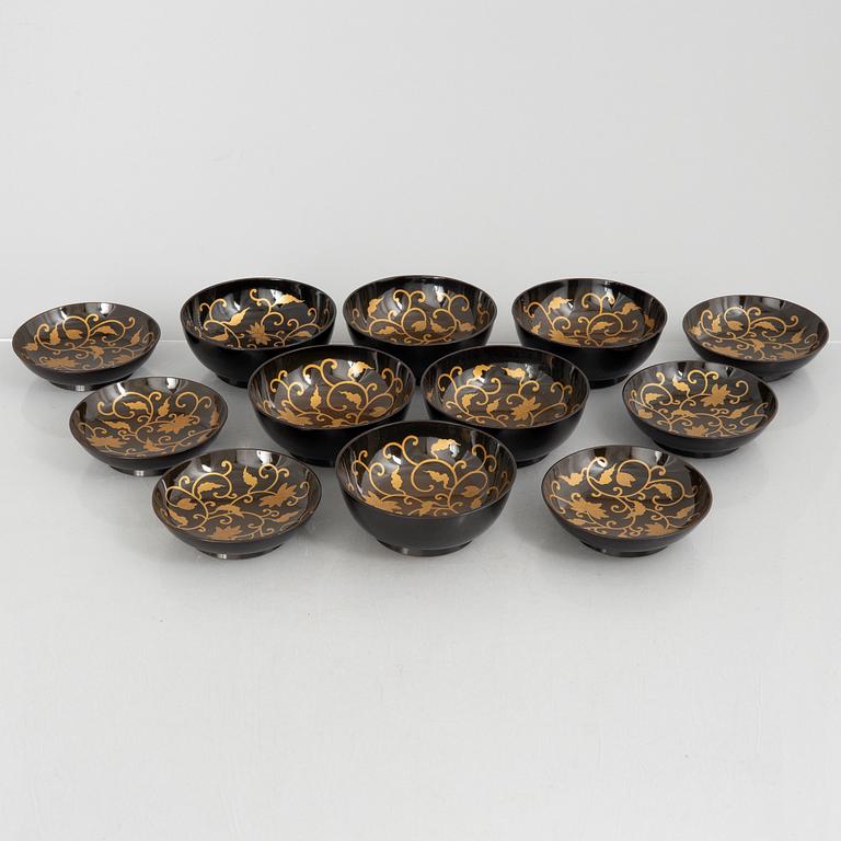 A set of six Japanese lacquer bowls with covers, 20th century.