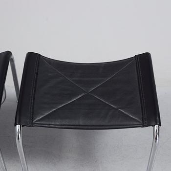 A pair of easy chairs and ottoman, designed by Hans Eichenberger, Strässle, Switzerland.