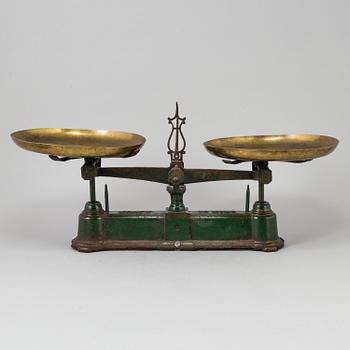 A 20th century cast iron balance with brass and iron weights, partly Skultuna, Sweden.