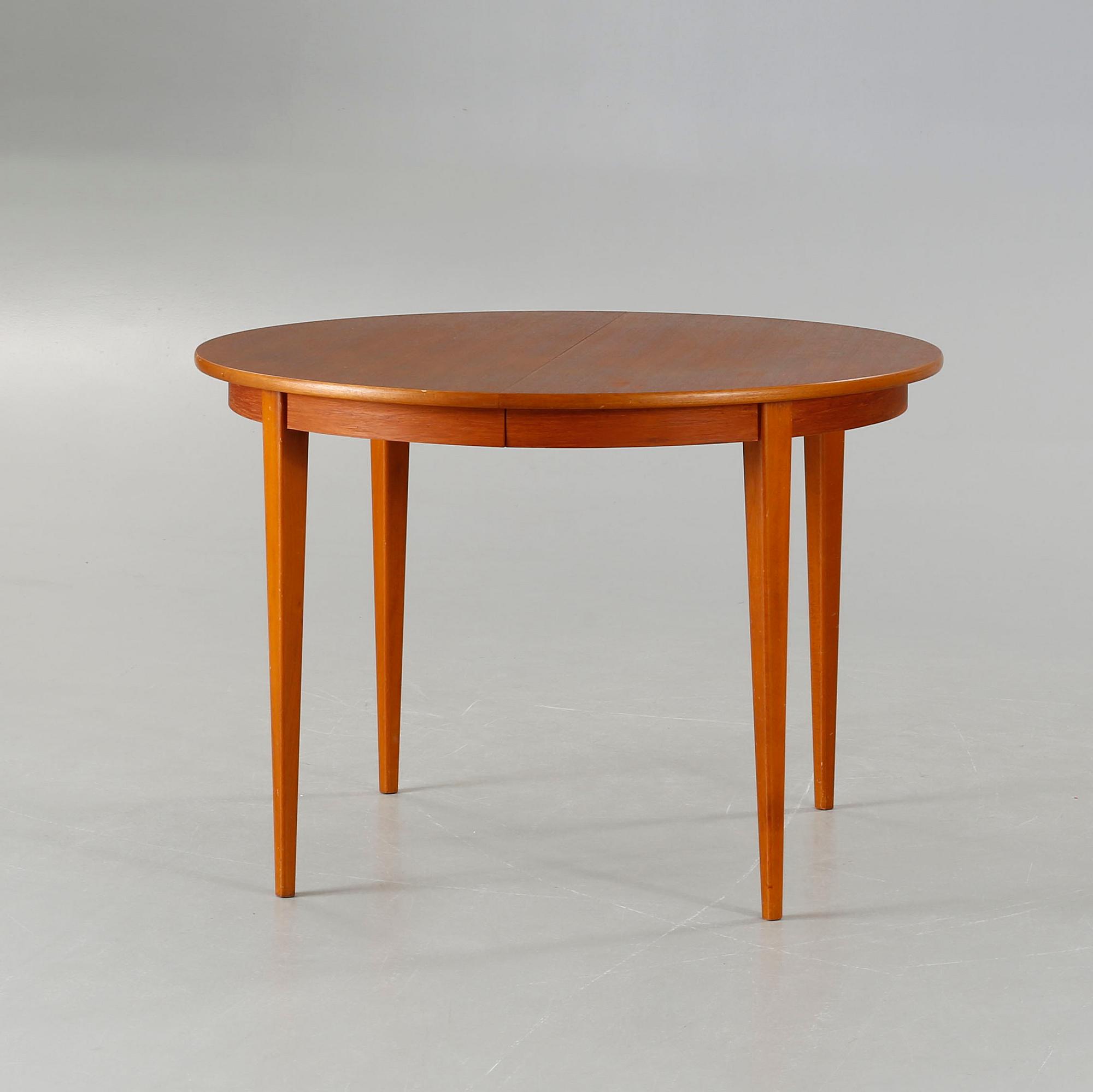 A dining table made in the middle of the 20th century.