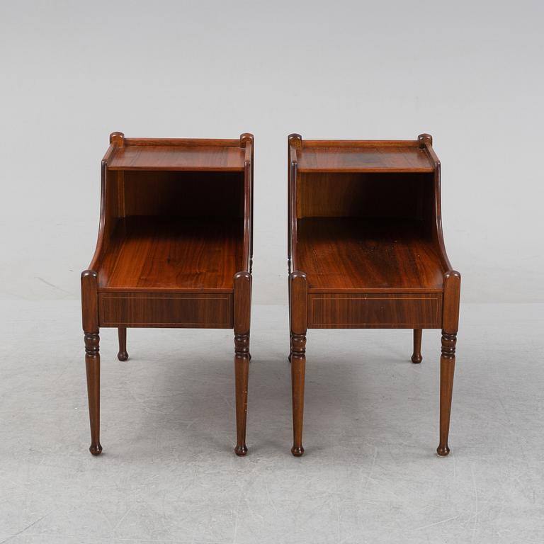 A pair of mahogany veneered bedside tables, later part of the 20th Century.