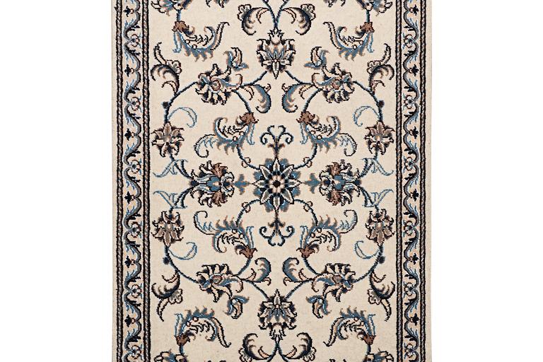 A runner carpet, Nain, part silk, c. 311 x 79 cm.