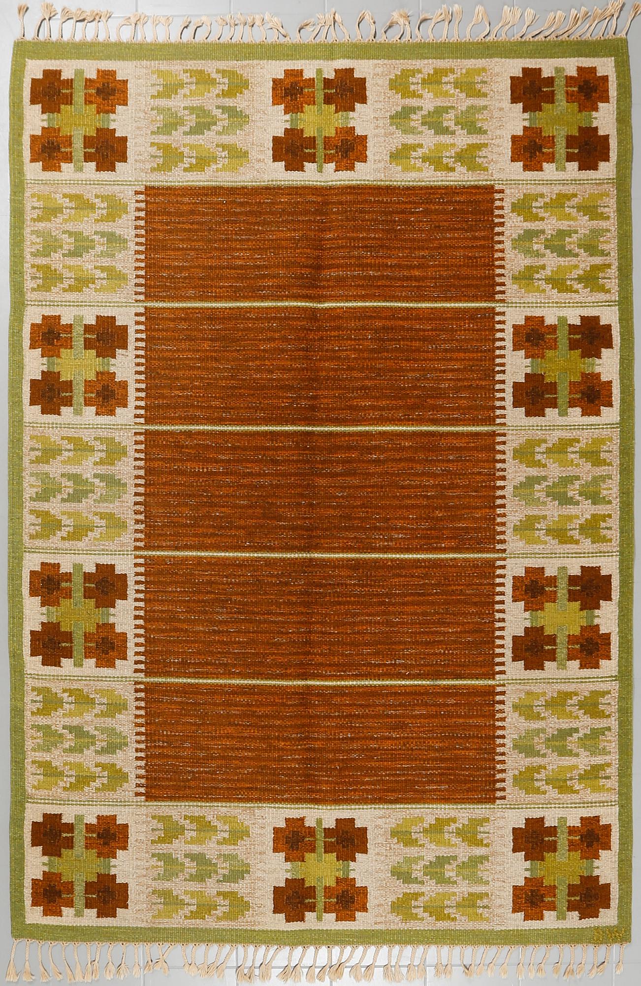 A flat weave by Berit Woelfer, signed BW, third quarter of the 20th century, 238 x 197 cm.