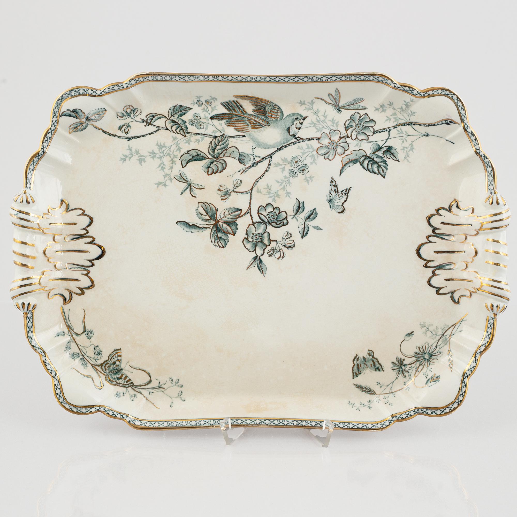 A 124-piece creamware dinner service, "Wexiö guld", Gustavsberg, Sweden, around 1900.