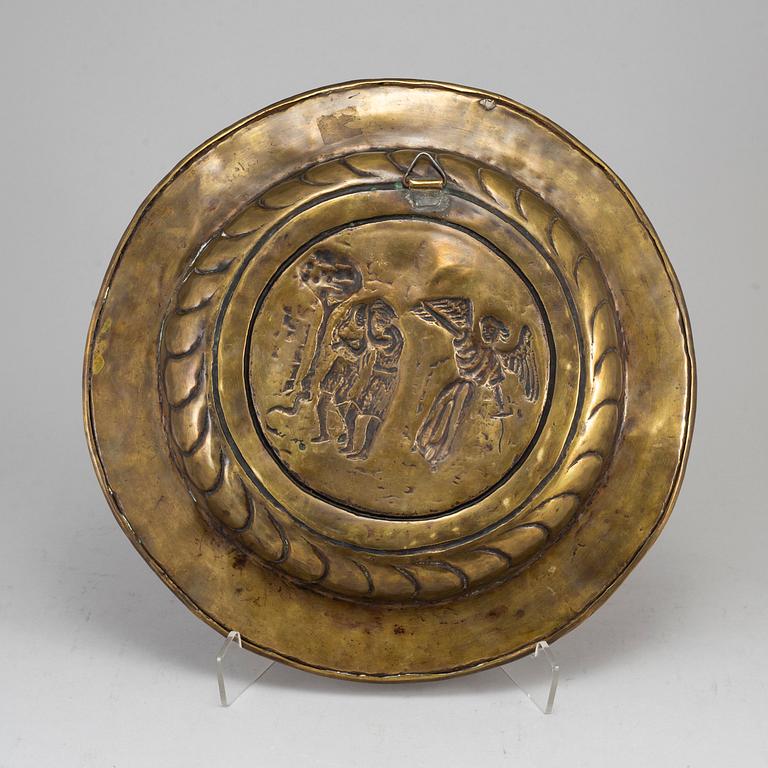 A renaissance style brass dish, late 19th century.