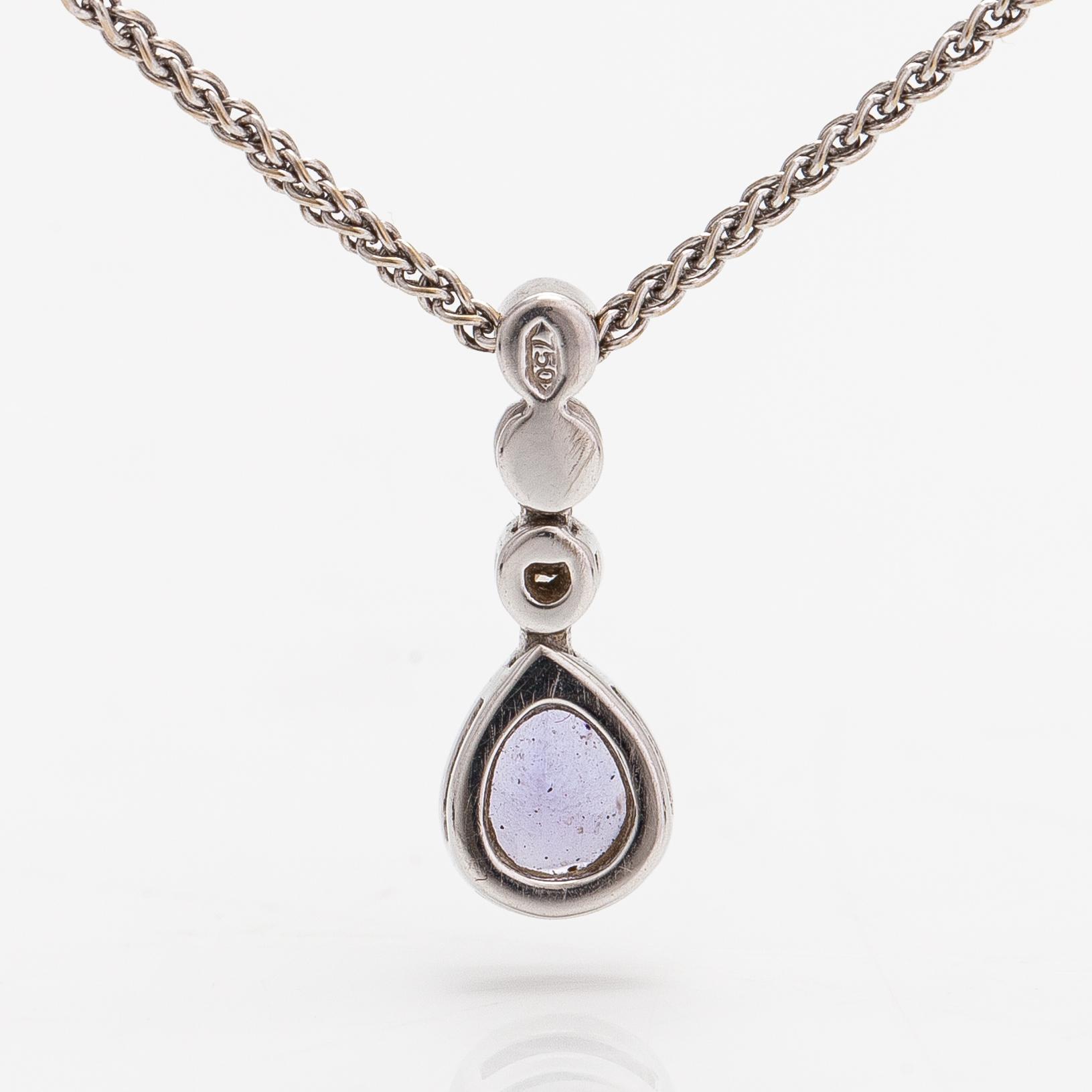 An 18K white gold necklace with a tanzanite and diamonds ca. 0.06 ct in total.