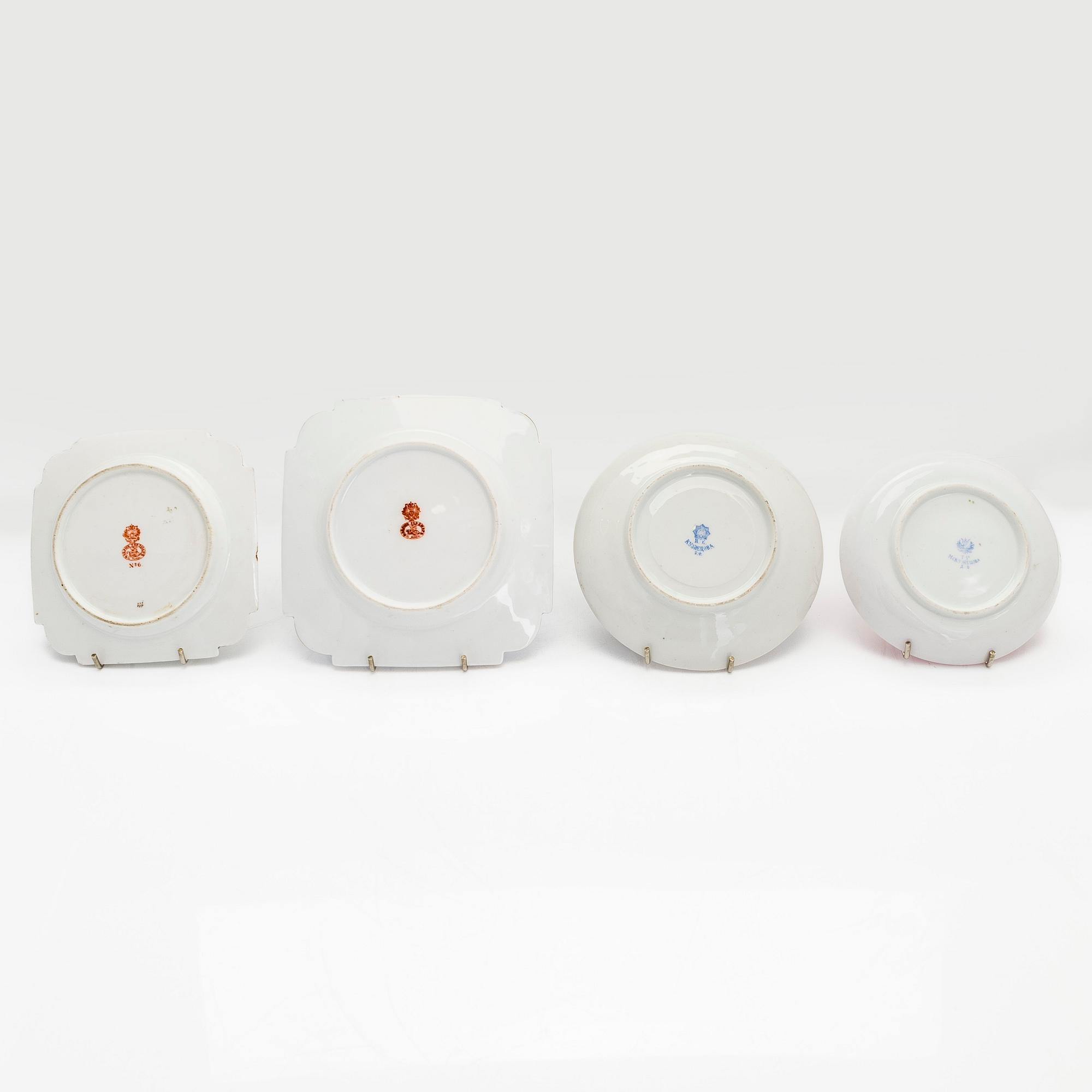 A 2-pcs set of porcelain cups with saucers, Kuznetsov and two plates, Gardner, various years 1880-1917.