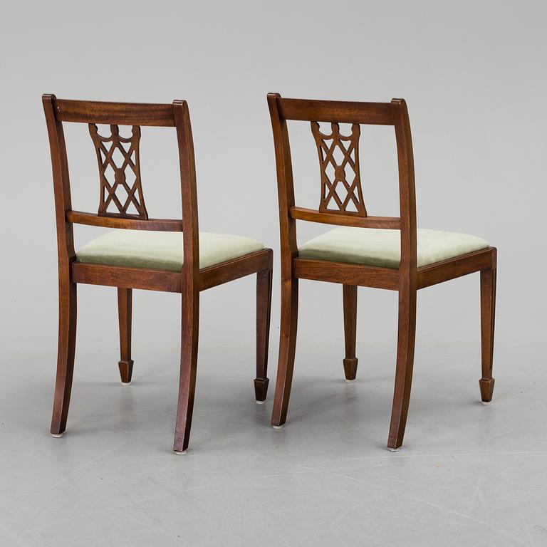 A set of eight chairs and a dining table, second half of the 20th century.