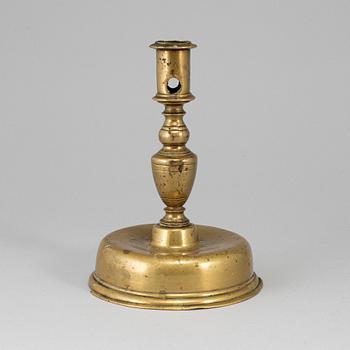 A 17th century bronze candlestick.