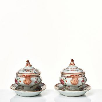 Two famille rose 'double peacock' butter tureens with covers and stands, Qing dynasty, Qianlong (1736-95).