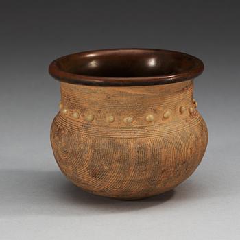 A brown and black glazed rice measurement cup, Song dynasty (960-1279).