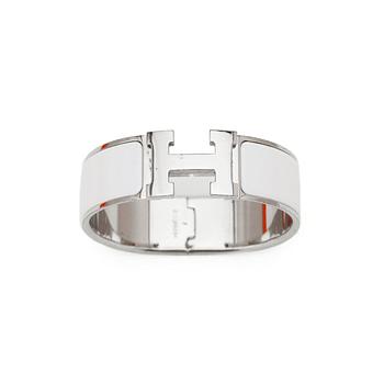 HERMÈS, a white enameled bracelet, "Clic H".
