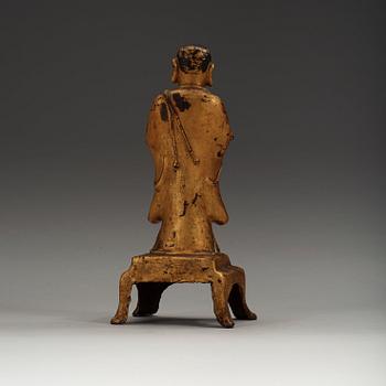 A lacquered gilt figure of a standing monk, Ming dynasty (1368-1644).