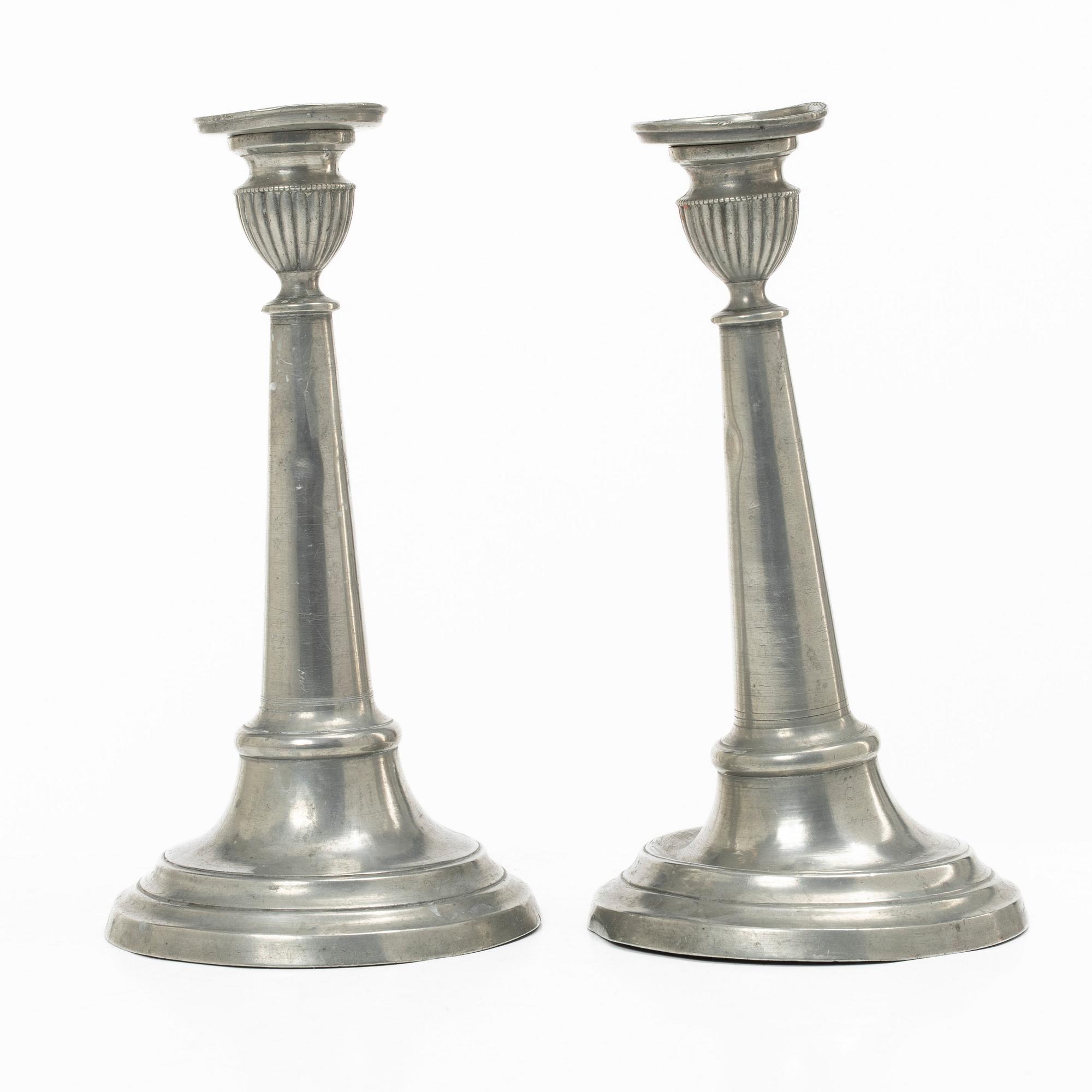 A pair of pewter candle sticks, Sweden, possibly 1844.