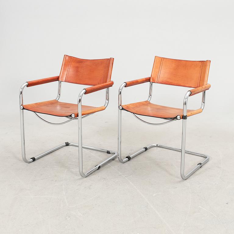 A set fo six Italian late 20th century chrome and leather armchairs.