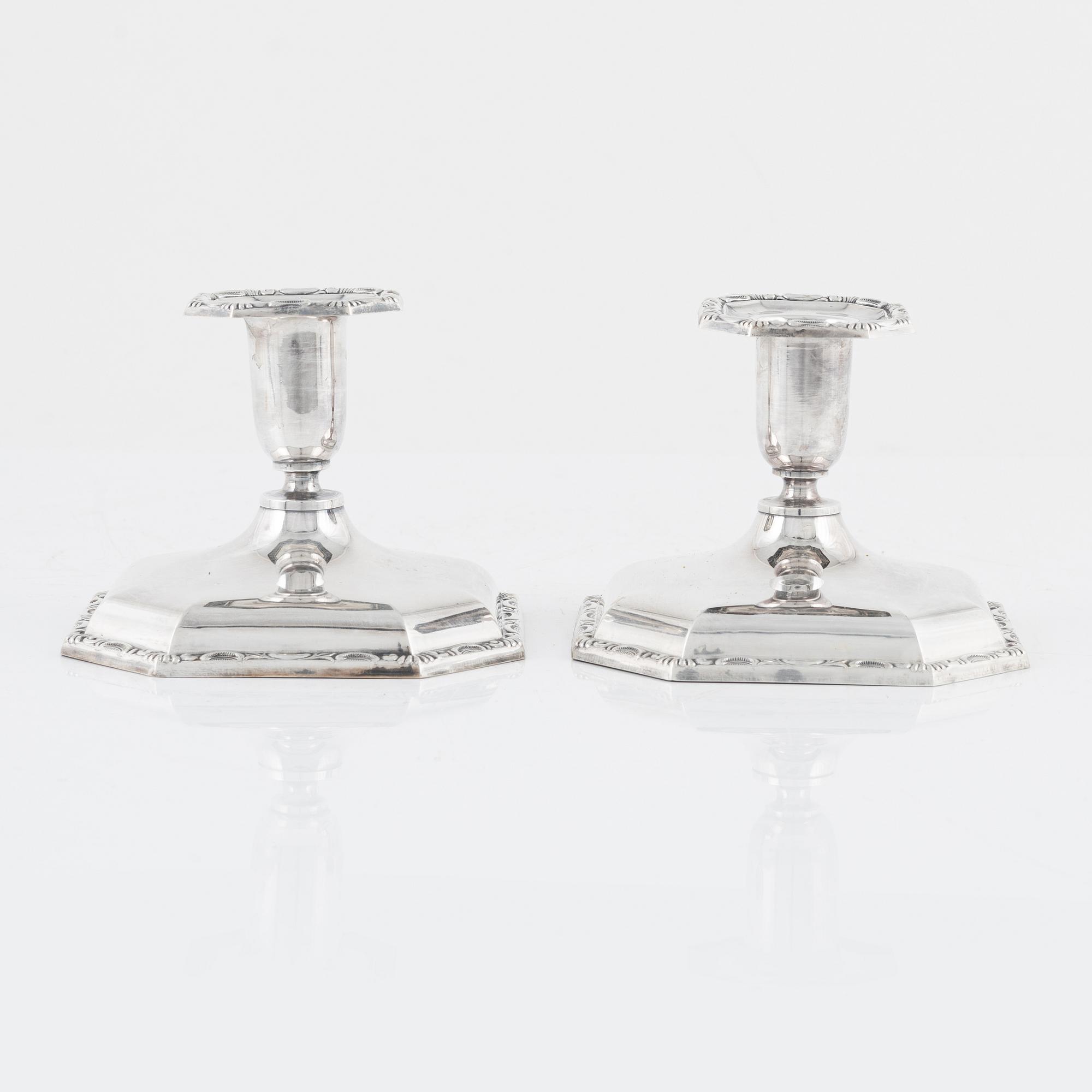 A Swedish Silver Ladle, mark of Adolf Öström, Piteå 1887 and a pair of Silver Candlesticks.