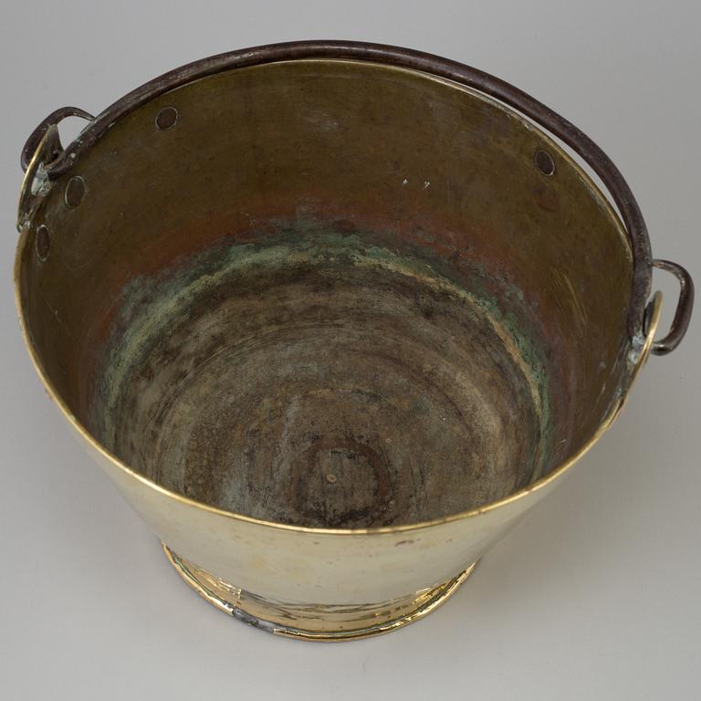 A 18th century brass bucket.