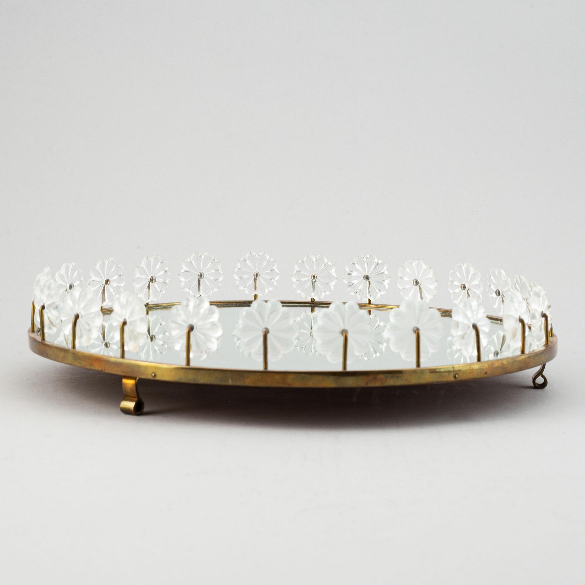 Estrid Ericson,  a mirror and brass table centrepiece from Svenskt Tenn.