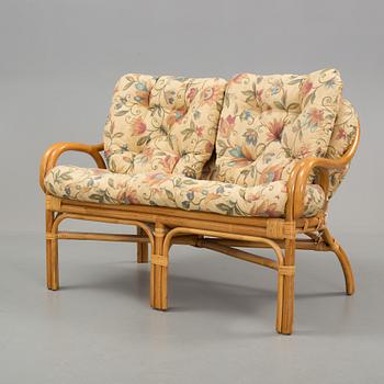 A set of sofa, easy chairs and table in four parts, late 20th century.