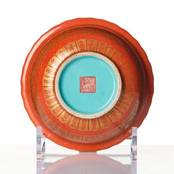 A coral red ground and gilt decorated turquoise enamelled bowl, Qing dynasty, Daoguang mark and period (1821-50).