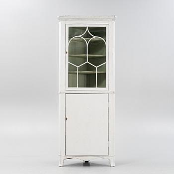 A gustavian style painted corner cabinet, 19th century.