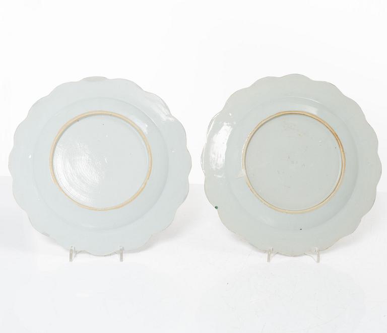 A pair of Chinese famille rose teacups with saucers and a pair of plates and two dishes, Qing dynasty, 18th century.