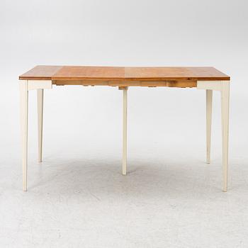 A dining table, mid-20th century.