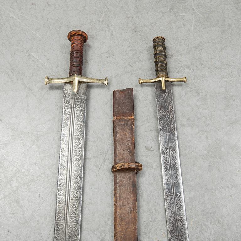 Two East African Kaskara swords- One with scabbard. 19-20th Century.