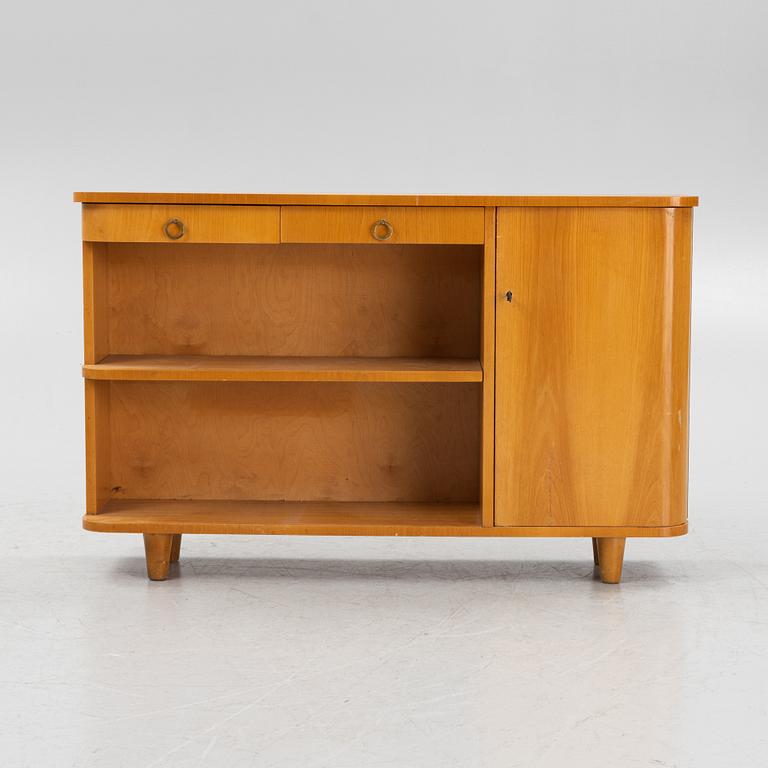 An elm wood veneered book case with drawers and cabinet, mid 20th Century.