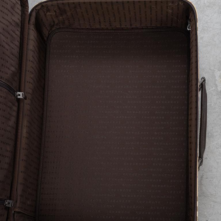 Burberry, a Nova Check canvas suitcase.