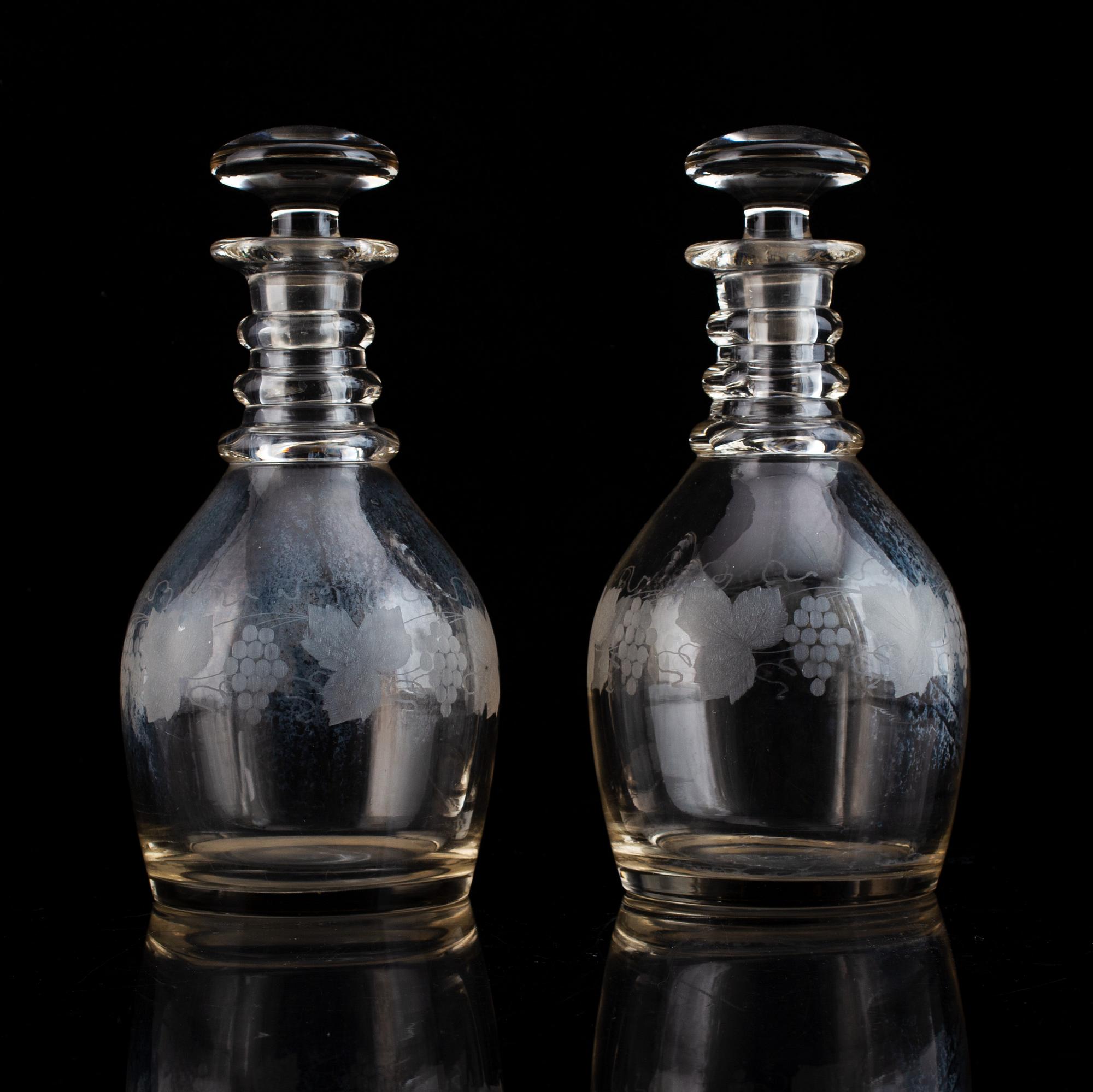 A pair of mid 19th century glass decanters and stoppers.
