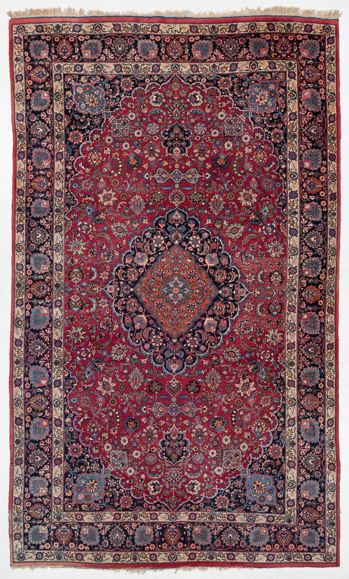 A semi-antique Mashad carpet, Eastern Iran, signed c. 507 x 303 cm.
