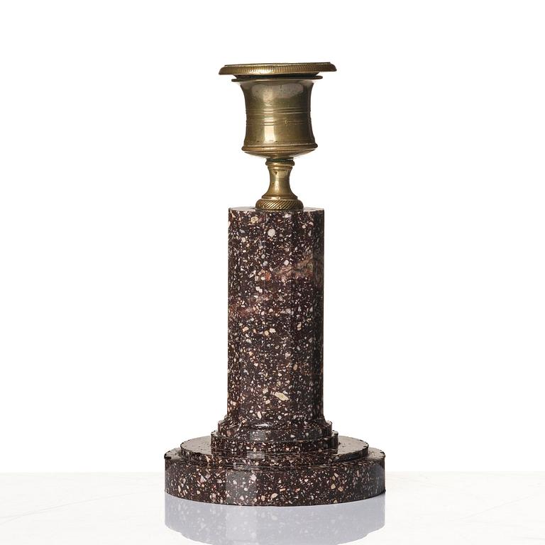 An Empire 'Blyberg' porphyry candlestick from Älvdalen, first part 19th century.