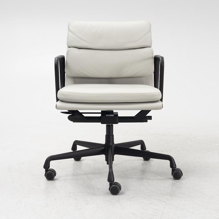 Charles & Ray Eames, a leather upholstered EA 217 soft pad office chair from VItra.