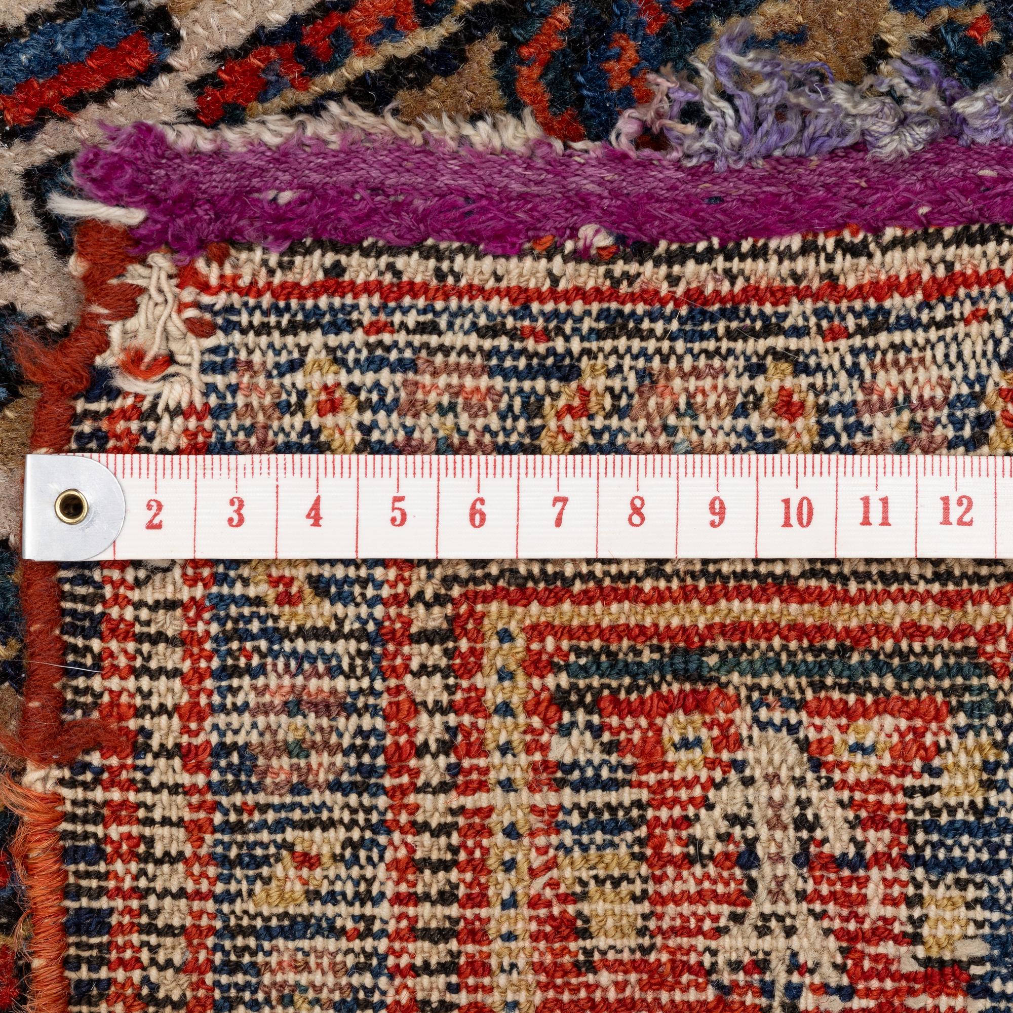 An antique Senneh rug, c 192 x 140 cm.