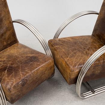 A pair of 'Hudson Street' lounge chairs from Ralph Lauren home.