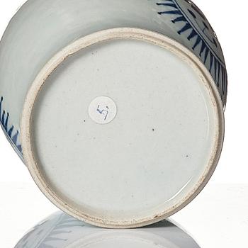 A small blue and white jar with the monogram IHS mirrored, Qing dynasty, 19th Century.