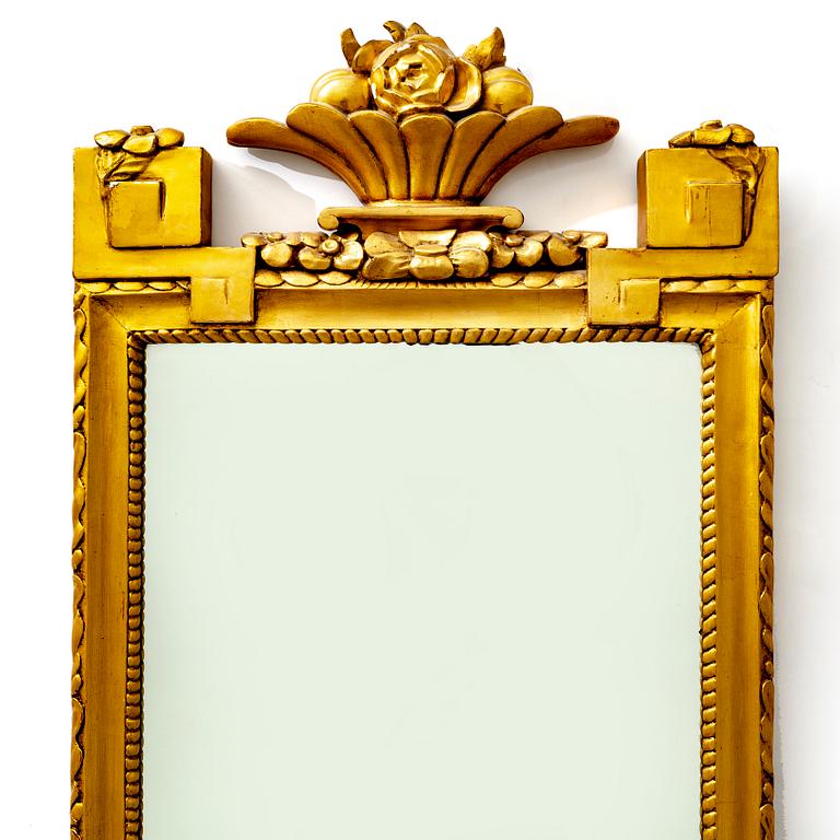 A gilded mid 1900s Gustavian style mirror.