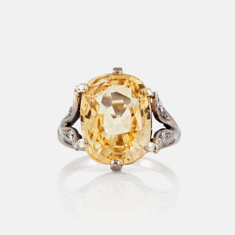 A yellow sapphire, circa 12.26 ct, ring.