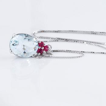 A aquamarine and ruby pendant.
