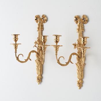 A pair of Louis XVI late 18th century gilt bronze two-light wall-lights.