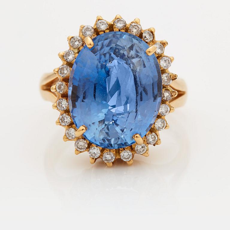 A RING set with a faceted sapphire.