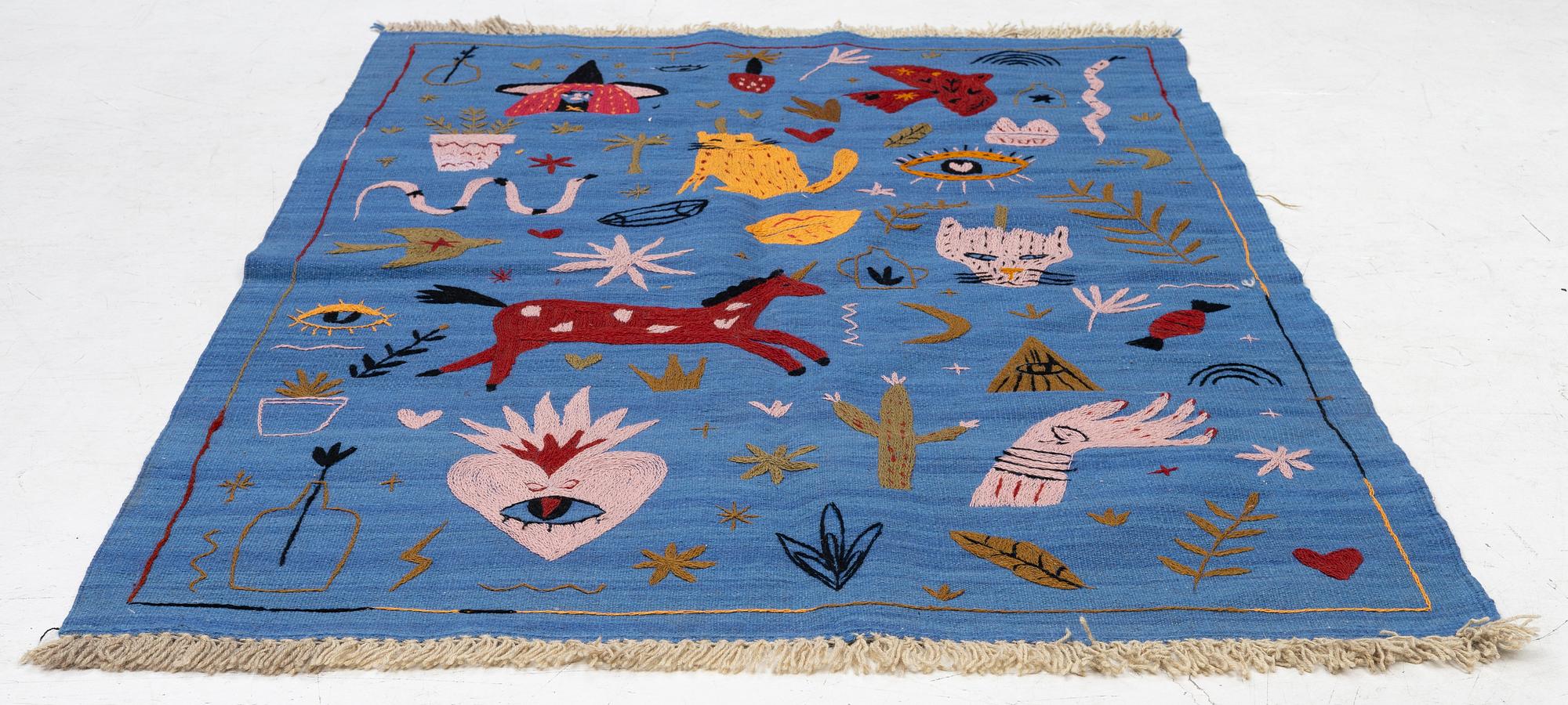 A hand-embroidered Kelim rug, 185 x 124 cm.