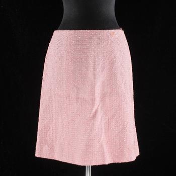 A pink bouclé skirt by Chanel.